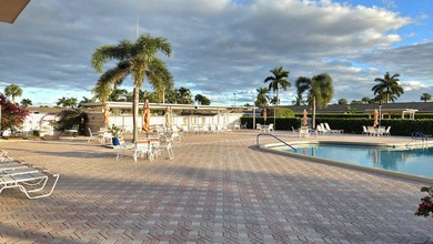 Welcome home to this beautifully upgraded villa in a peaceful - photo 16