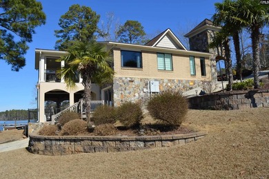 Remarkable waterfront home in a cove with lakefront views. - photo 2