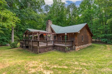 One-owner custom built log home on 2.5 acres on a small lake - photo 2
