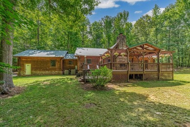 One-owner custom built log home on 2.5 acres on a small lake - photo 3