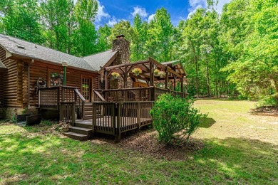 One-owner custom built log home on 2.5 acres on a small lake - photo 5