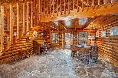 One-owner custom built log home on 2.5 acres on a small lake - photo 9
