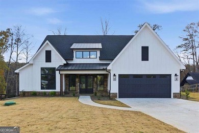 Nestled directly on the banks of the Etowah River, this - photo 2