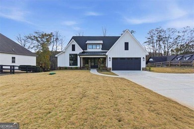 Nestled directly on the banks of the Etowah River, this - photo 5