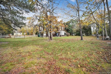 Multi-Family: Located down a tree lined street in the hamlet of - photo 9