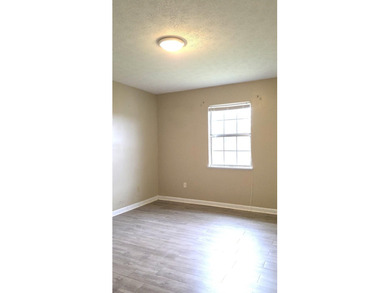 This 3-bedroom, 2-bath home with a garage and fenced backyard - photo 12