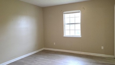 This 3-bedroom, 2-bath home with a garage and fenced backyard - photo 13
