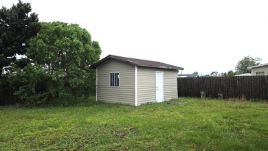 This 3-bedroom, 2-bath home with a garage and fenced backyard - photo 19