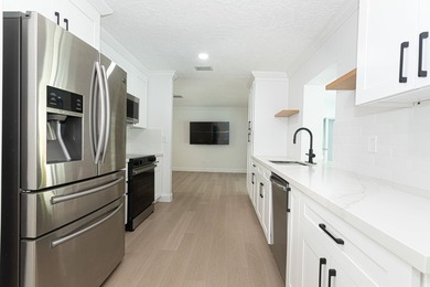 Tucked away on an oversized corner lot in the sought-after - photo 16