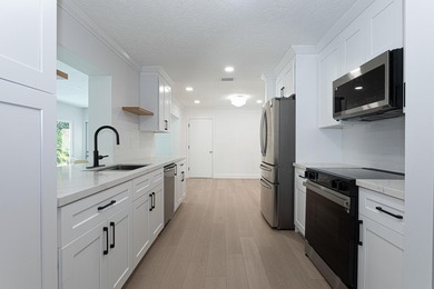 Tucked away on an oversized corner lot in the sought-after - photo 17