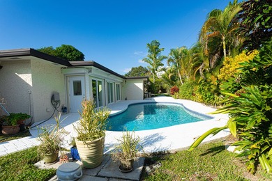 Tucked away on an oversized corner lot in the sought-after - photo 24