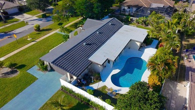 Tucked away on an oversized corner lot in the sought-after - photo 46