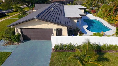 Tucked away on an oversized corner lot in the sought-after - photo 48