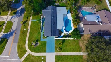 Tucked away on an oversized corner lot in the sought-after - photo 50