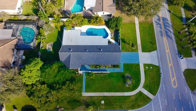 Tucked away on an oversized corner lot in the sought-after - photo 52