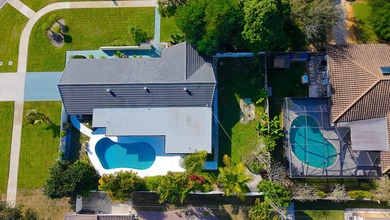 Tucked away on an oversized corner lot in the sought-after - photo 55