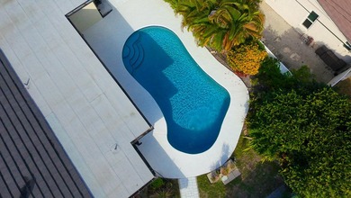 Tucked away on an oversized corner lot in the sought-after - photo 56