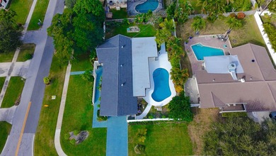 Tucked away on an oversized corner lot in the sought-after - photo 58