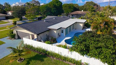 Tucked away on an oversized corner lot in the sought-after - photo 59