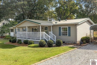 Discover lakeside living in this charming 3 bedroom, 2 bathroom - Lake Home For Sale in Murray, Kentucky