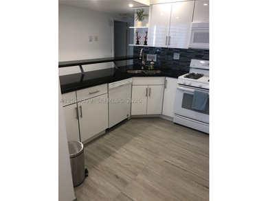 UNIT COMPLETELY REMODELED. OPEN GRANITE AND STAINLESS KITCHEN - photo 22