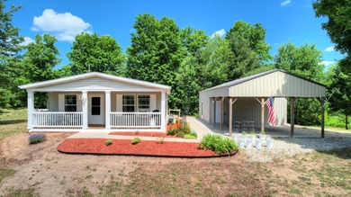 (private lake, pond, creek) Home Sale Pending in South Boardman Michigan