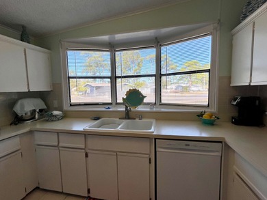 This meticulously maintained two-bedroom, two-bath home is - photo 6