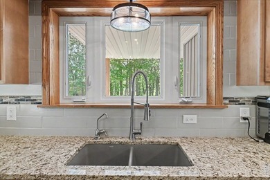 Tucked among the trees on 2 scenic acres just outside the - photo 13