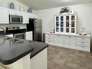 Welcome to this beautifully maintained Colony Patio Villa in the - photo 13