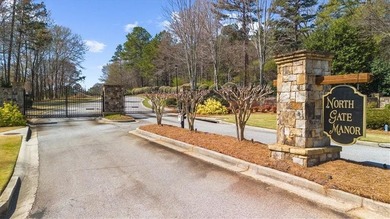 Set within the gated enclave of North Gate Manor, a sought-after - photo 3