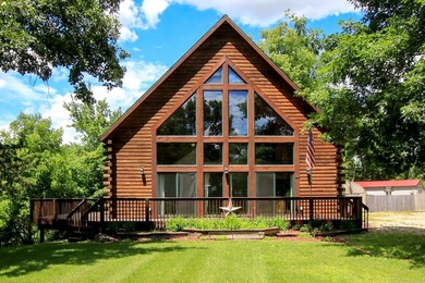 Tucked away on 6.6 wooded acres, this 3-bedroom, 2-bath home - photo 1
