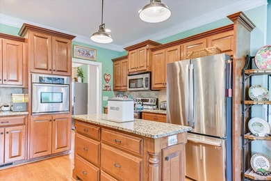 This exquisite home in the prestigious Windmill Plantation