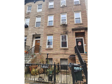 Located in Clinton Hill, 60 PUTNAM AVE, a three-family - photo 1