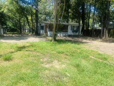 Just a walk to Cedar Creek Lake, this property sits on a - Lake Home For Sale in Mabank, Texas