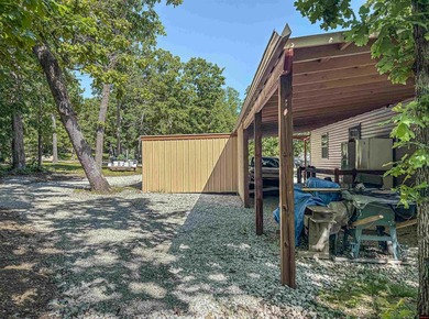 Tucked away in the beautiful Ozarks near Bull Shoals Lake, this - photo 10
