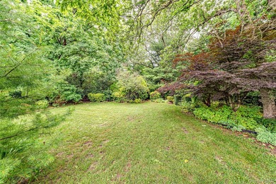 Set on an impressive 75' x 220' property in Bay Shore, this - photo 26