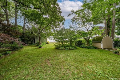 Set on an impressive 75' x 220' property in Bay Shore, this - photo 27