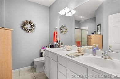 Enjoy peaceful lake living in this beautifully situated