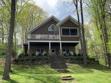 This is Truly an EXCEPTIONAL LAKEFRONT Home that was built in - Lake Home Sale Pending in Millersburg, Ohio