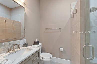 This distinctive custom-built residence nestled among the