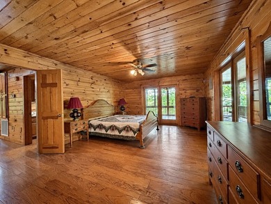 Tucked into a private wooded setting on top of the mountain in - photo 9