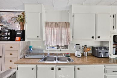 Welcome to this inviting 3-bedroom, 2-bath mobile home offering - photo 18