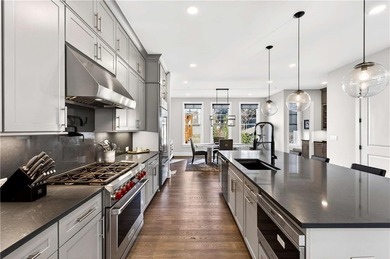 Just one year old and like new, this luxury townhome is located