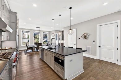 Just one year old and like new, this luxury townhome is located