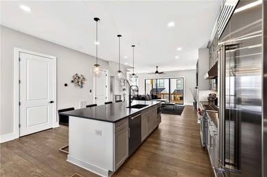 Just one year old and like new, this luxury townhome is located