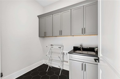 Just one year old and like new, this luxury townhome is located