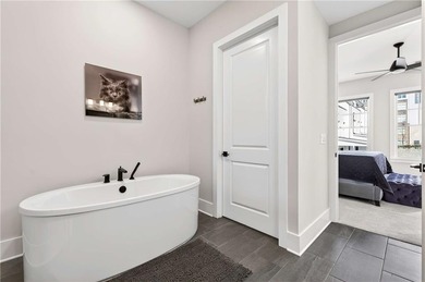 Just one year old and like new, this luxury townhome is located