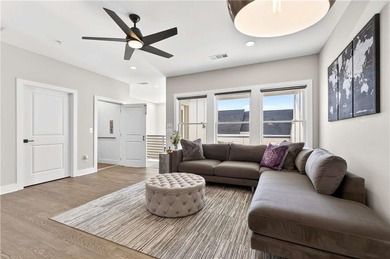 Just one year old and like new, this luxury townhome is located