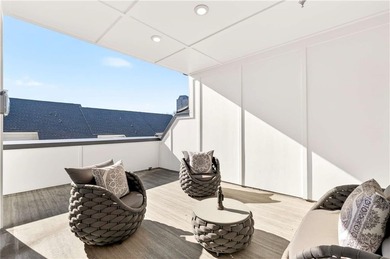 Just one year old and like new, this luxury townhome is located