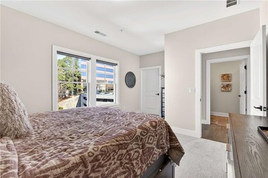 Just one year old and like new, this luxury townhome is located